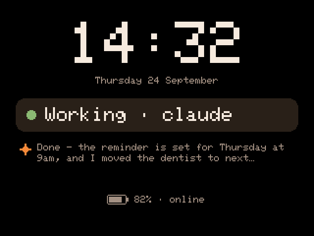 The standby face again, now saying Working, claude.